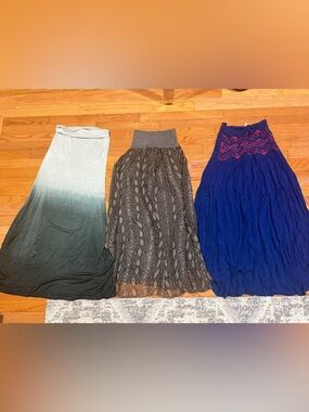 3 long skirts, 38” long. 2 are size XS, one is one size. Worn twice.